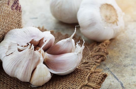 Garlic on sackcloth with the old floor.