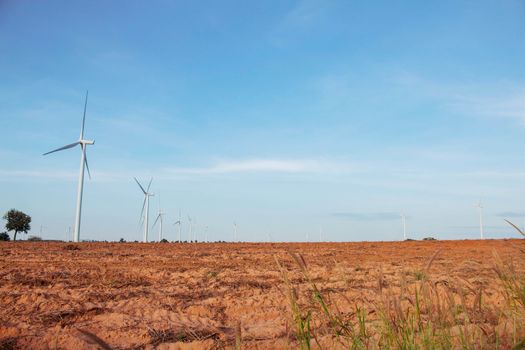 Windmill in the countryside with blue sky.