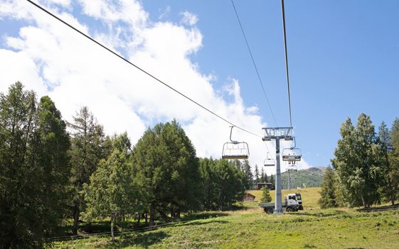 Chair lift and landscape, summertime in Switzerlans