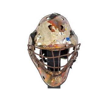 Old hockey mask for goalkeeper protection isolated on white background