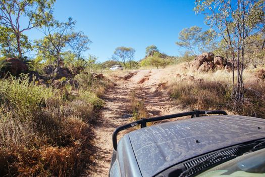 Mt Surprise, Australia - July 6, 2016: A 4WD car negotiating a rural track in the outback near Mt Surprise, Queensland, Australia