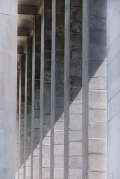 Rectangular marble columns lighted by the sun ,vertical composition from the bottom to the top ,marble colors and veins highlighted