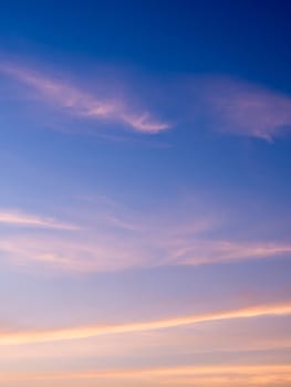 White fluffy clouds in the blue sky with morning light from the sunrise