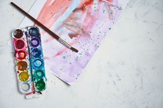 Set of watercolor paints white background. Brushes drawing. Creative background. School for teaching drawing. With copy space for text