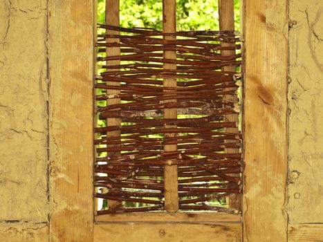 detail of an old wall made of willow and earth