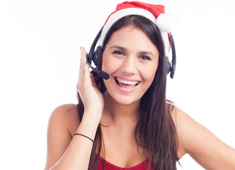 Christmas headset woman from telemarketing call center wearing red santa hat talking smiling isolated on white background.