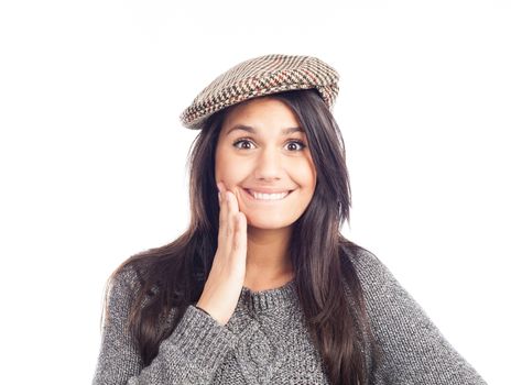 pretty smiling and cheerful brunette woman with a french cap and a wool sweater