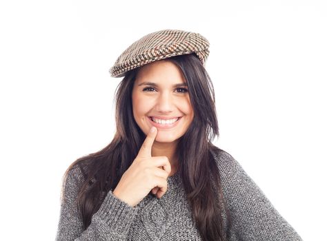 pretty smiling and cheerful brunette woman with a french cap and a wool sweater