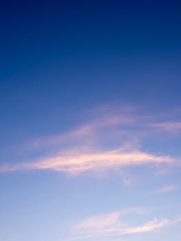 White fluffy clouds in the blue sky with morning light from the sunrise