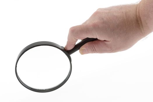 A magnifying glass being held by a hand isolated on white with clear lens