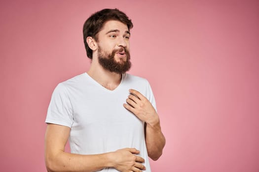 cheerful bearded man white t-shirt emotions cropped view pink background. High quality photo