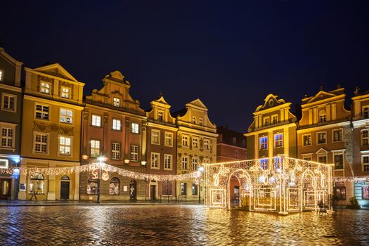 The Market Square with historic tenement houses andl and christmas decorations in city of Poznan