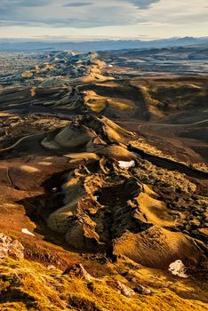 Lakagigar volcanic fissure at sunset illuminated by golden light, Iceland