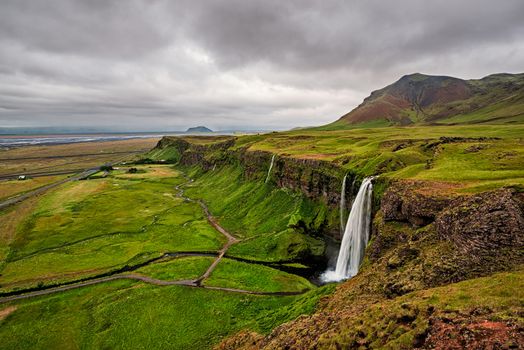 Seljalandsfoss waterfall in a cloudy day seen from above, Iceland