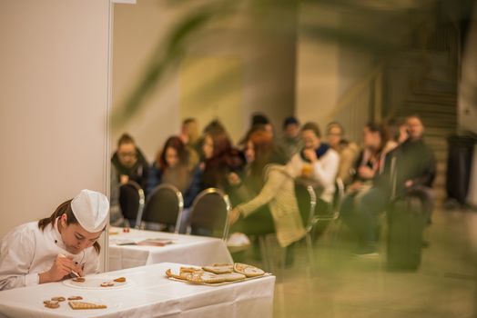 Woman are preparing food while attending an event at the convention trade center in Brno. BVV Brno Exhibition center. Czech Republic