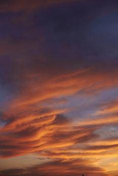 Sunset. Heaven, orange sky. Sun rays. Wallpaper. Clouds.