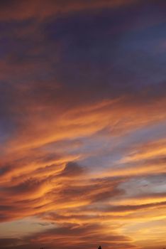 Sunset. Heaven, orange sky. Sun rays. Wallpaper. Clouds.