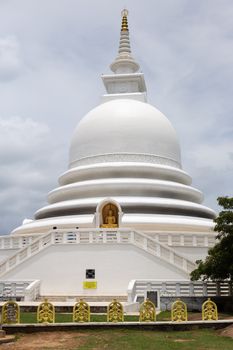 Unawatuna, Sri Lanka 15.4.2018 Japanese Peace Pagoda white temple against blue. High quality photo