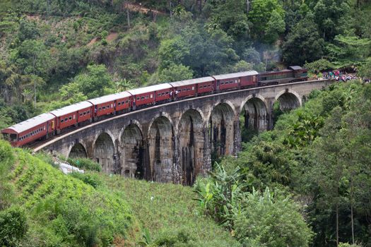 Ella Sri Lanka 4.15.2018 the 9 arch famous Demodara Railway Bridge with train built 100 years ago. High quality photo