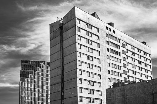 Concrete and glass facades of modern buildings in Poznan city, monochrome