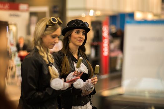 Women eating ice cream at the convention trade center in Brno. BVV Brno Exhibition center. Czech Republic