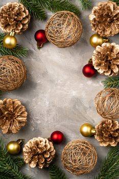 Christmas composition. Golden ornament, pine cones and fir needles decorations. Copy space