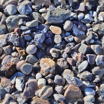 Photo realistic seamless texture pattern of pebbles and stones at a baltic sea beach