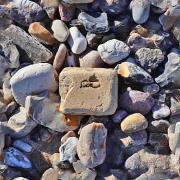 Photo realistic seamless texture pattern of pebbles and stones at a baltic sea beach