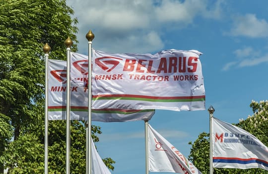 Belarus, Minsk - 27.05.2017: White flag with the logo of the Minsk Tractor Plant