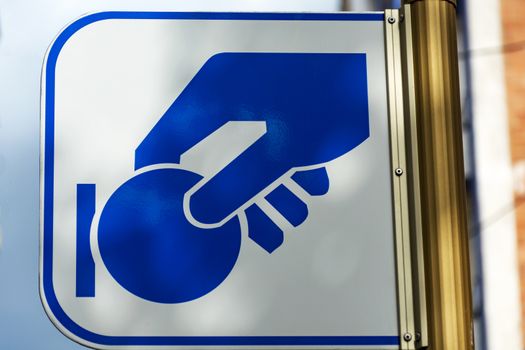A close-up of the information sign "Paid parking"