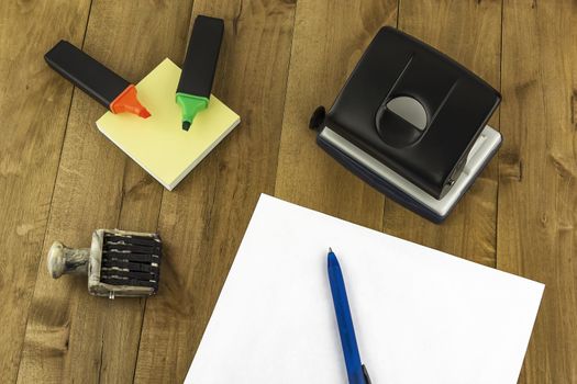 A variety of stationery are on the table