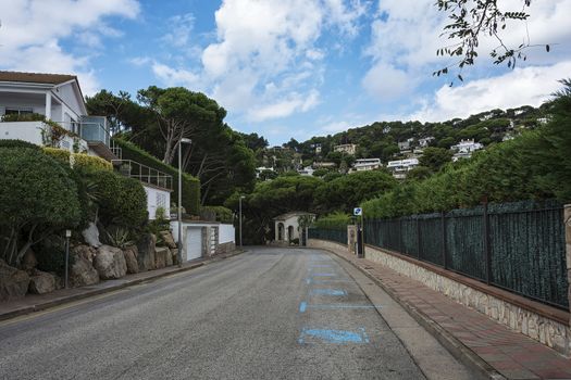 On the roadway of the city street there is a marking "Paid parking" (Blanes, Spain)