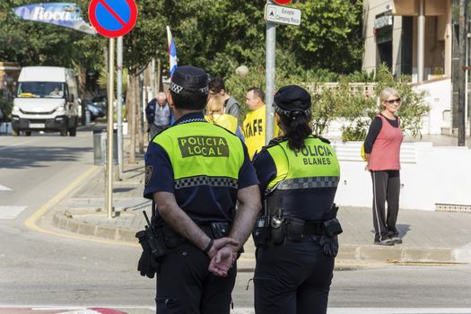 Spain, Blanes - 09/23/2017: Police stand at the crossroads of the city street