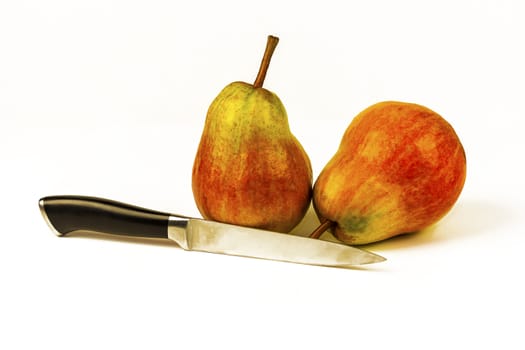 On a white background two large ripe pears and a knife