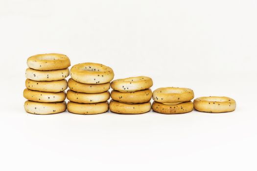 On a white background, the drying with poppy seeds is spread out with a ladder