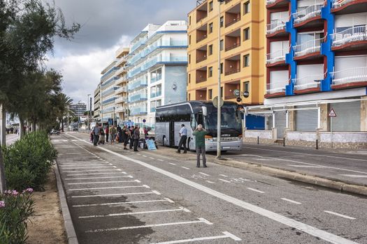 Spain, Blanes - 16.09.2017: Embarkation of passengers in a tourist bus on the city street