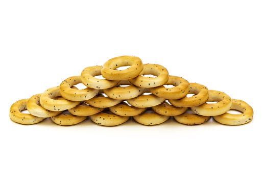 Baranka with poppy seeds stacked on top of each other on a white background