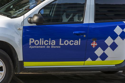 On the door of a police car, Policia Local (Blanes, Catalonia, Spain)