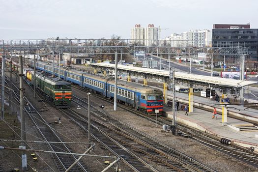 Belarus, Minsk - 03/04/2017: Railway station. Suburban train and freight train