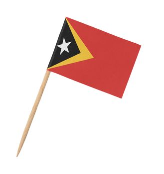Small paper flag of East Timor on wooden stick, isolated on white