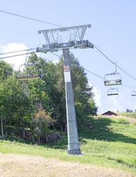 Chair lift and landscape, summertime in Switzerlans