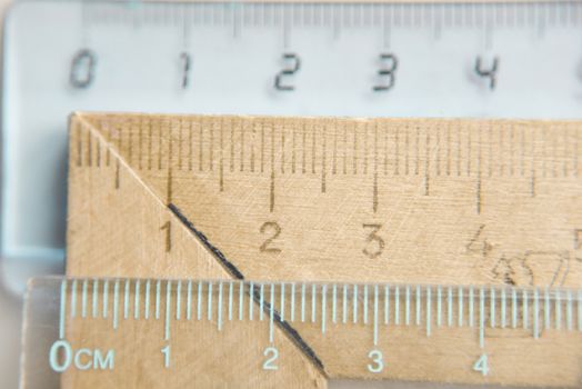 plastic and wooden rulers fragments, selective focus