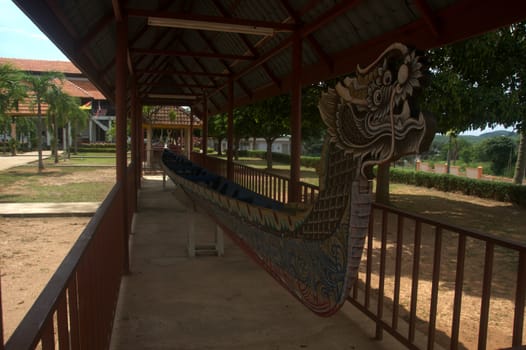 a traditional malay ethnic wooden dragon boat used for transportation and war in ancient time is displayed at Lukut Museum Port Dickson Malaysia