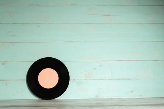 Vinyl record on wooden background,Old vintage vinyl record isolated