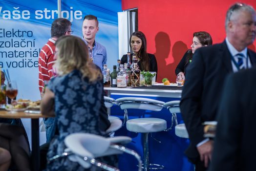 Colleagues having a drink attending the Amper event at the convention trade center in Brno. BVV Brno Exhibition center. Czech Republic