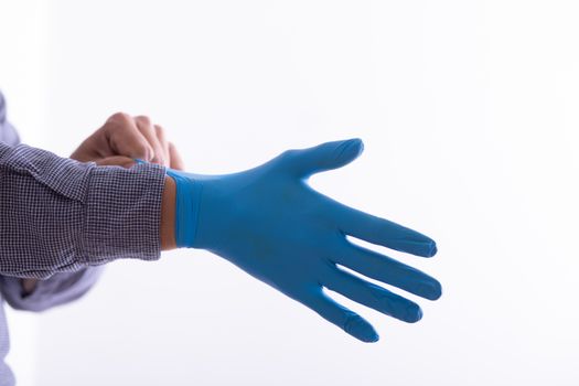 Man Wearing Gloves For Protection From Virus Stock Photo