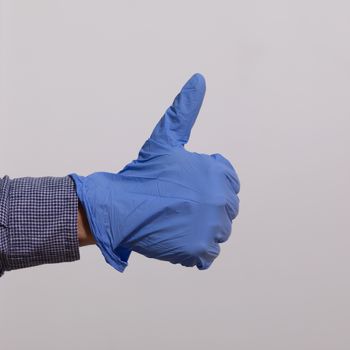 Man showing gesture - Everything is just fine in Gloves Stock Photo