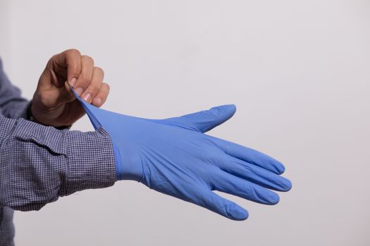 Man Wearing Gloves For Protection From Virus Stock Photo