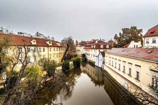 Autumn dawn in historic Prague at Charles Bridge over the Vltava River. Prague, ENESCO monument, Czech Republic