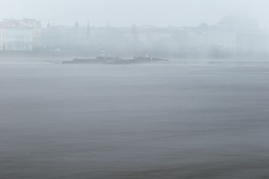 Autumn dawn in historic Prague at Charles Bridge over the Vltava River. Prague, ENESCO monument, Czech Republic